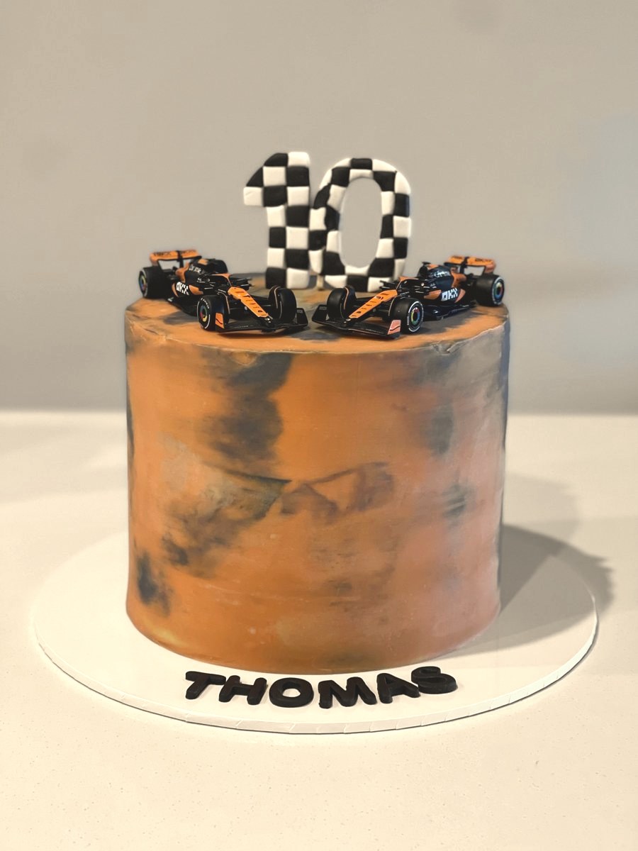 Marbled terracotta cake with a chequered number topper