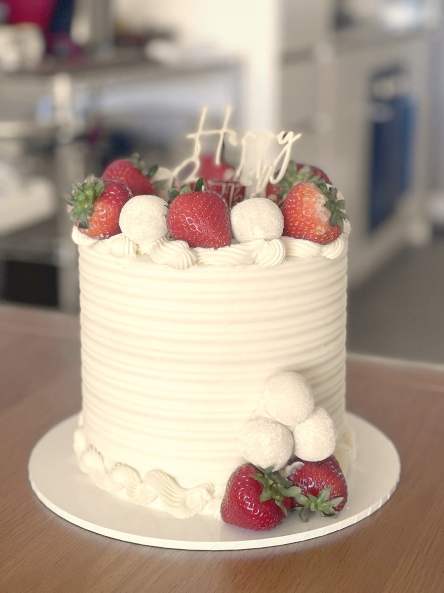 Ridged buttercream cake with strawberries and white truffles
