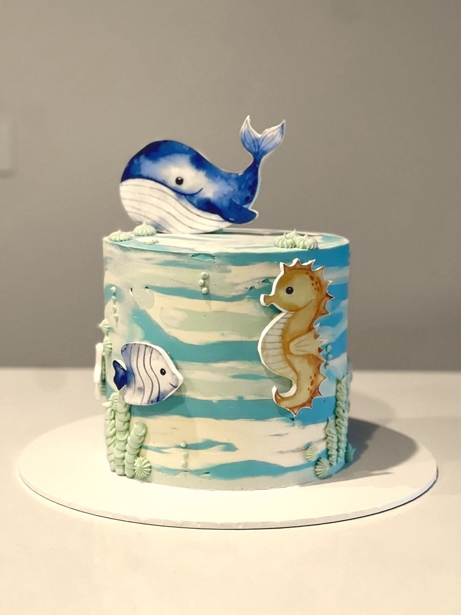 Watercolour sea cake with a hand-painted whale