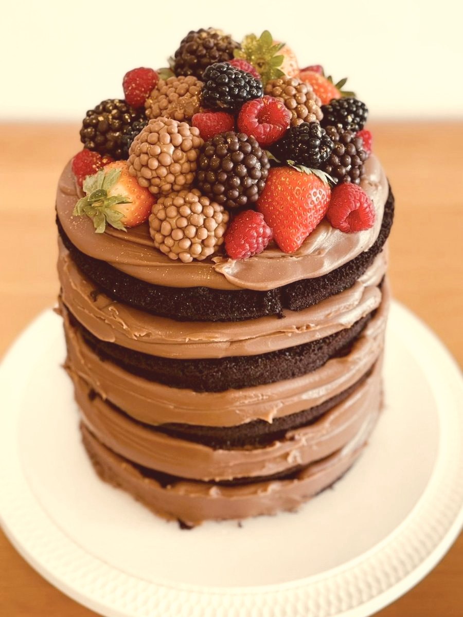Chocolate naked cake with fresh berries